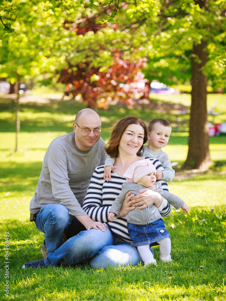 Fototapeta premium Family in park outside in summer