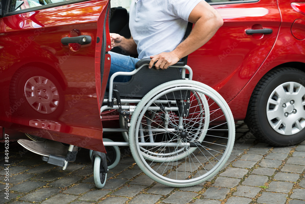 Fototapeta premium Disabled Man Boarding In His Car