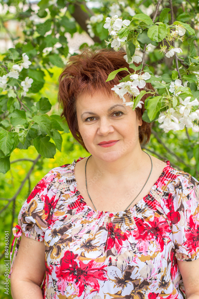 Middle-aged woman on a background of Apple Middle-aged woman on a background of Apple