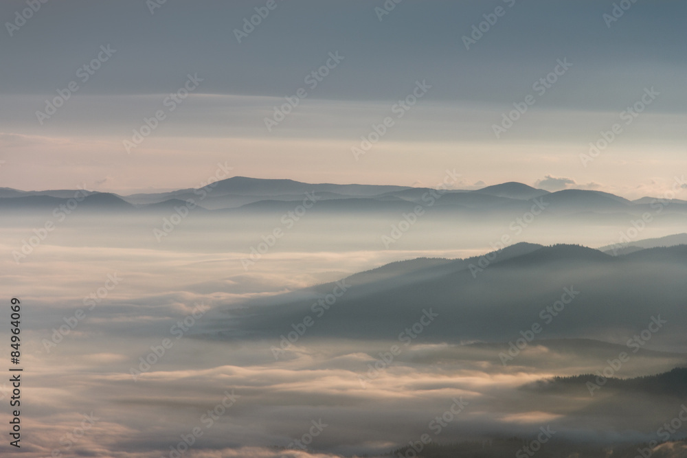 Landscape misty mountains in the morning sunlight.