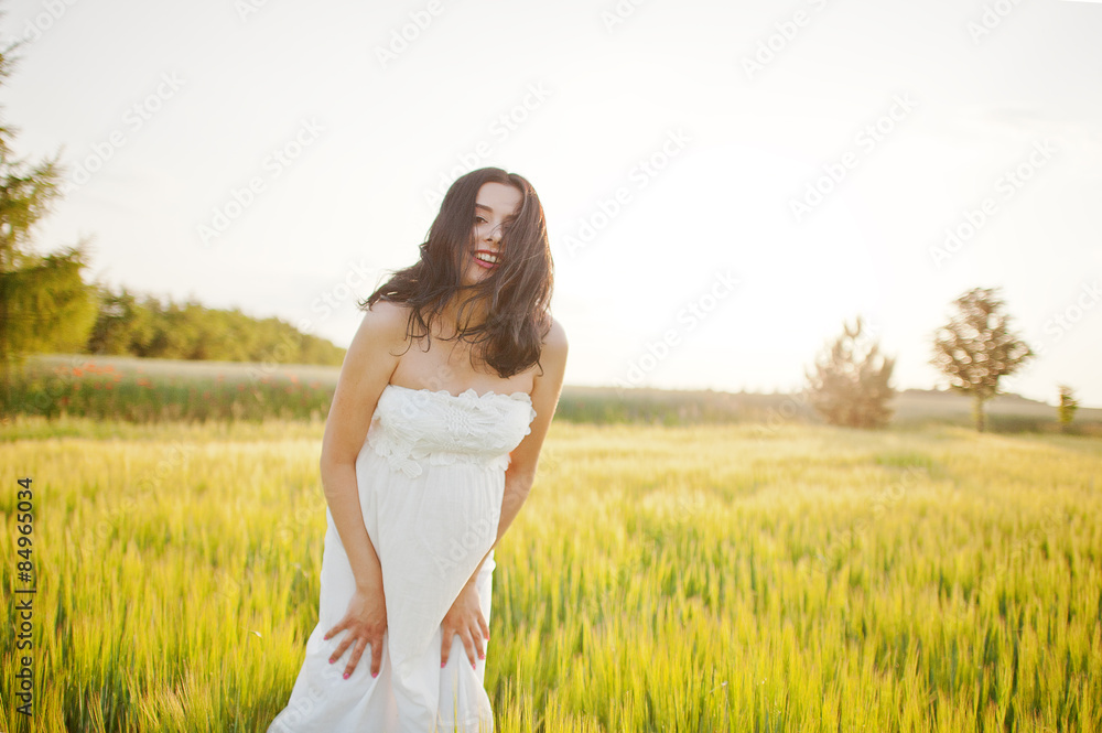pregnant gorgeous brunette woman on the field with wheat and pop pregnant gorgeous brunette woman on the field with wheat and pop