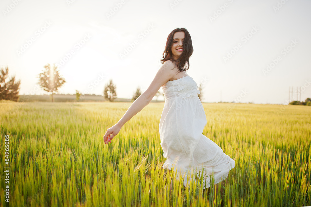 pregnant gorgeous brunette woman on the field with wheat and pop pregnant gorgeous brunette woman on the field with wheat and pop
