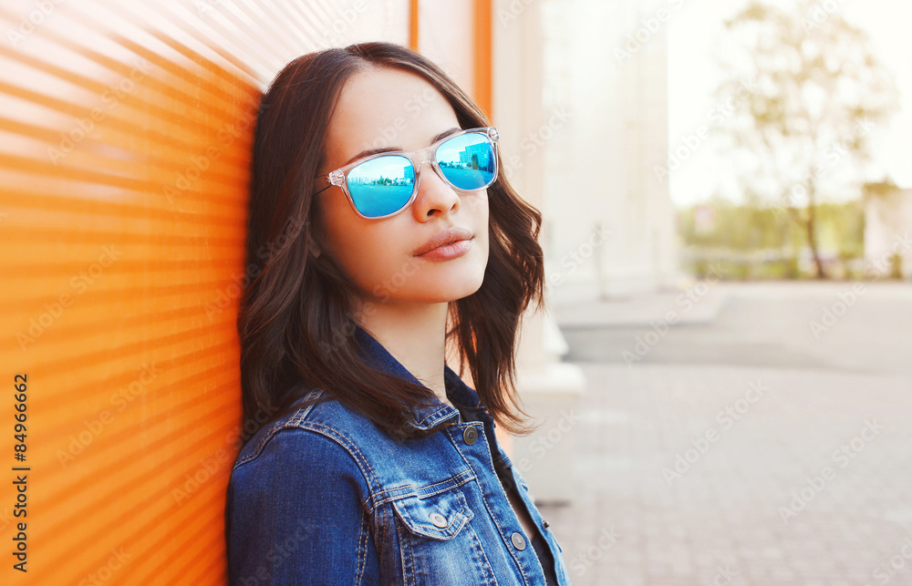 Fashion portrait of beautiful young woman in the sunglasses Fashion portrait of beautiful young woman in the sunglasses