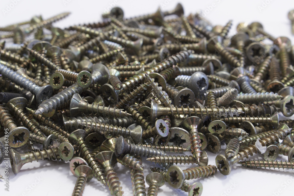 Carpentry screws of various sizes on white Carpentry screws of various sizes on white