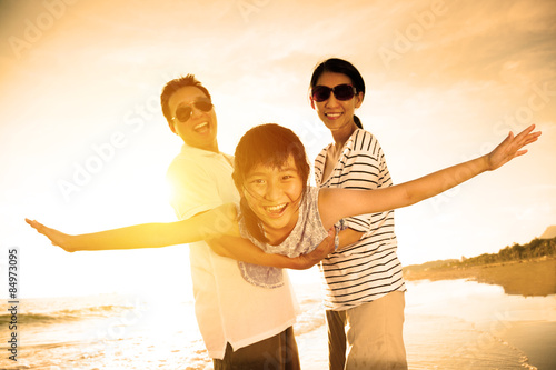 happy family enjoy summer vacation on the beach © Tom Wang
