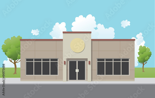 A low density, suburban office building with a generic, fake stucco exterior. 