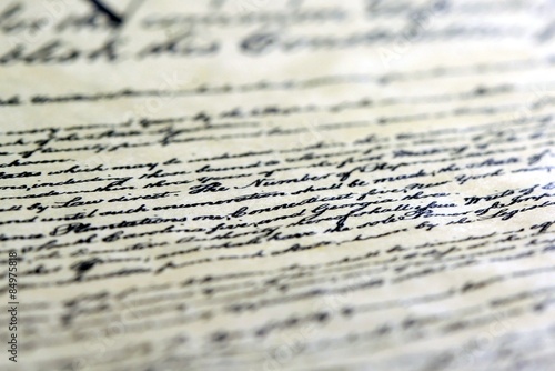 Calligraphy handwriting on old vintage paper