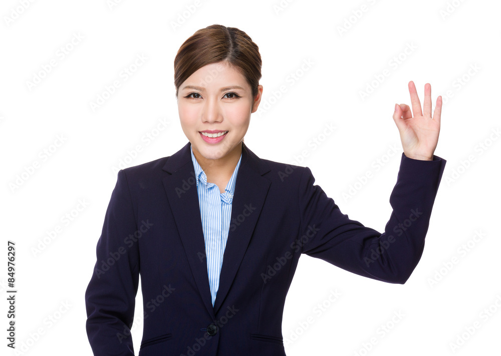 Businesswoman with ok sign gesture Businesswoman with ok sign gesture