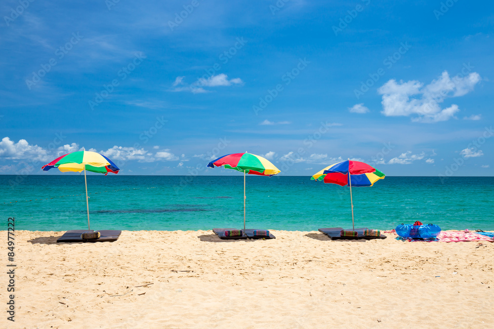 beach umbrella and ring on beach with blue sky, phuket thailand