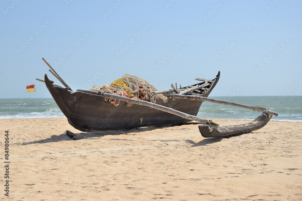 Traditional indian fishing boat at the beach of Kerala, India