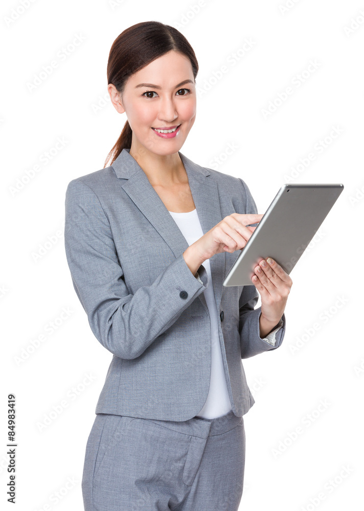 Young businesswoman touch on tablet pc Young businesswoman touch on tablet pc