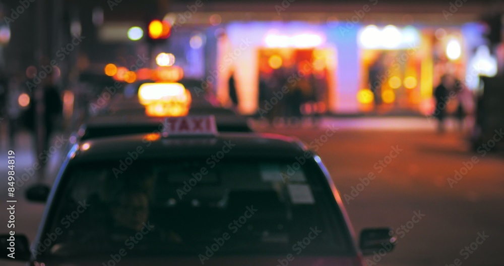 driver of taxi cab looking for customers on Hongkong street at night driver of taxi cab looking for customers on Hongkong street at night