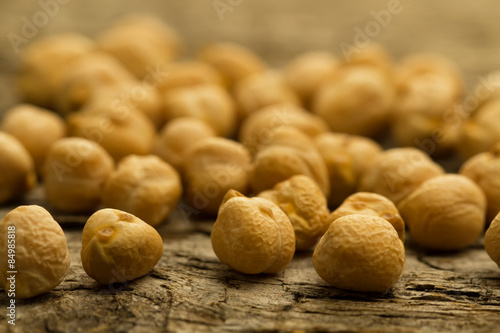 bunch of chickpeas on the old wooden background. Indian cuisine photo