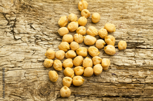 bunch of chickpeas on the old wooden background. Indian cuisine
