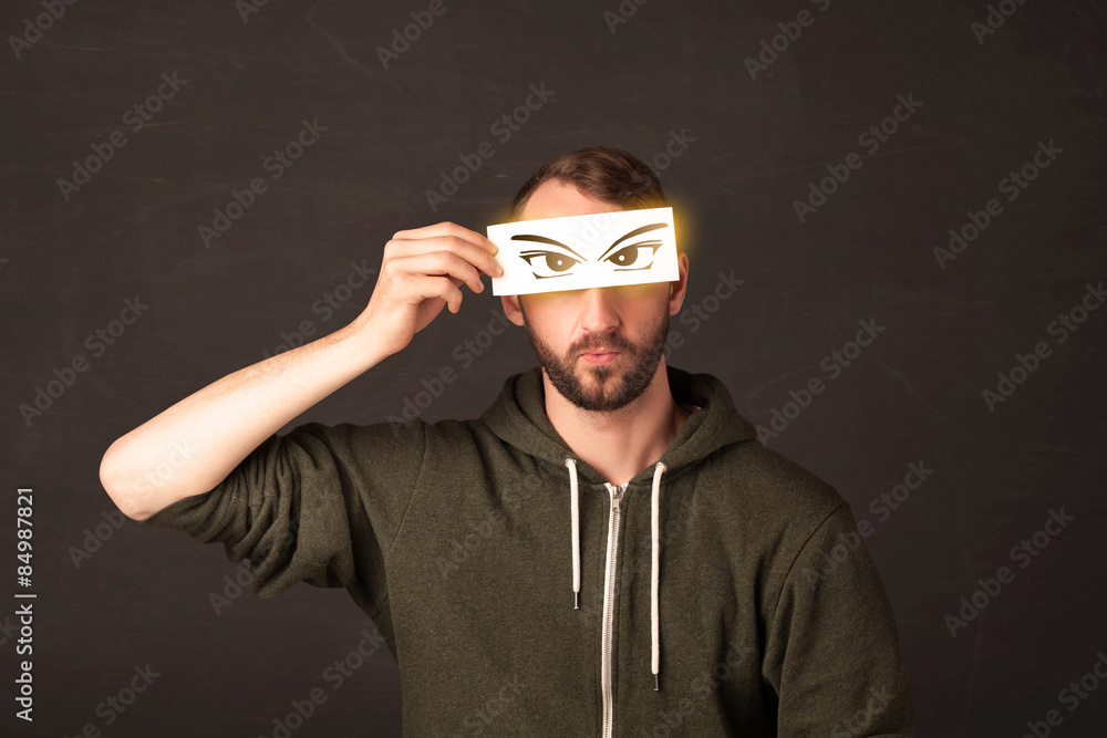Cool youngster looking with a paper hand drawn eyes Cool youngster looking with a paper hand drawn eyes