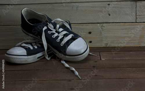 Old shoes on a wooden floor