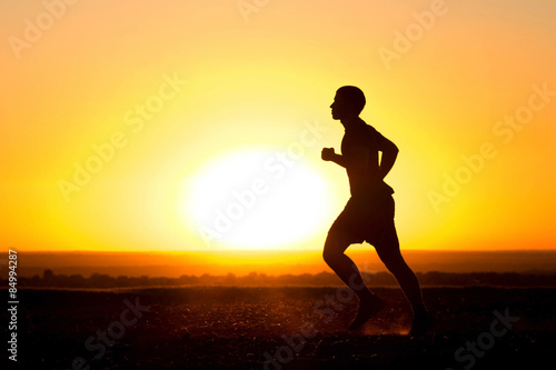 a young man running in the field