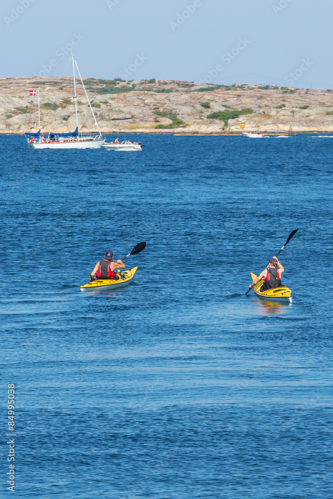 Kayakers on the sea in summer