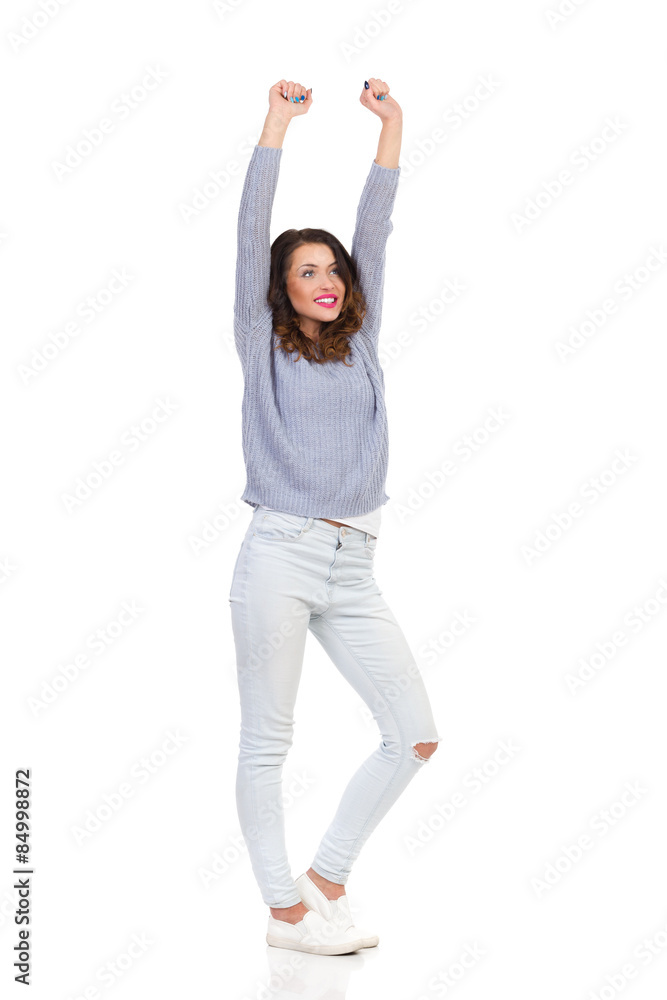 Happy Young Woman Standing With Arms Raised. Full length studio shot isolated on white. Happy Young Woman Standing With Arms Raised. Full length studio shot isolated on white.