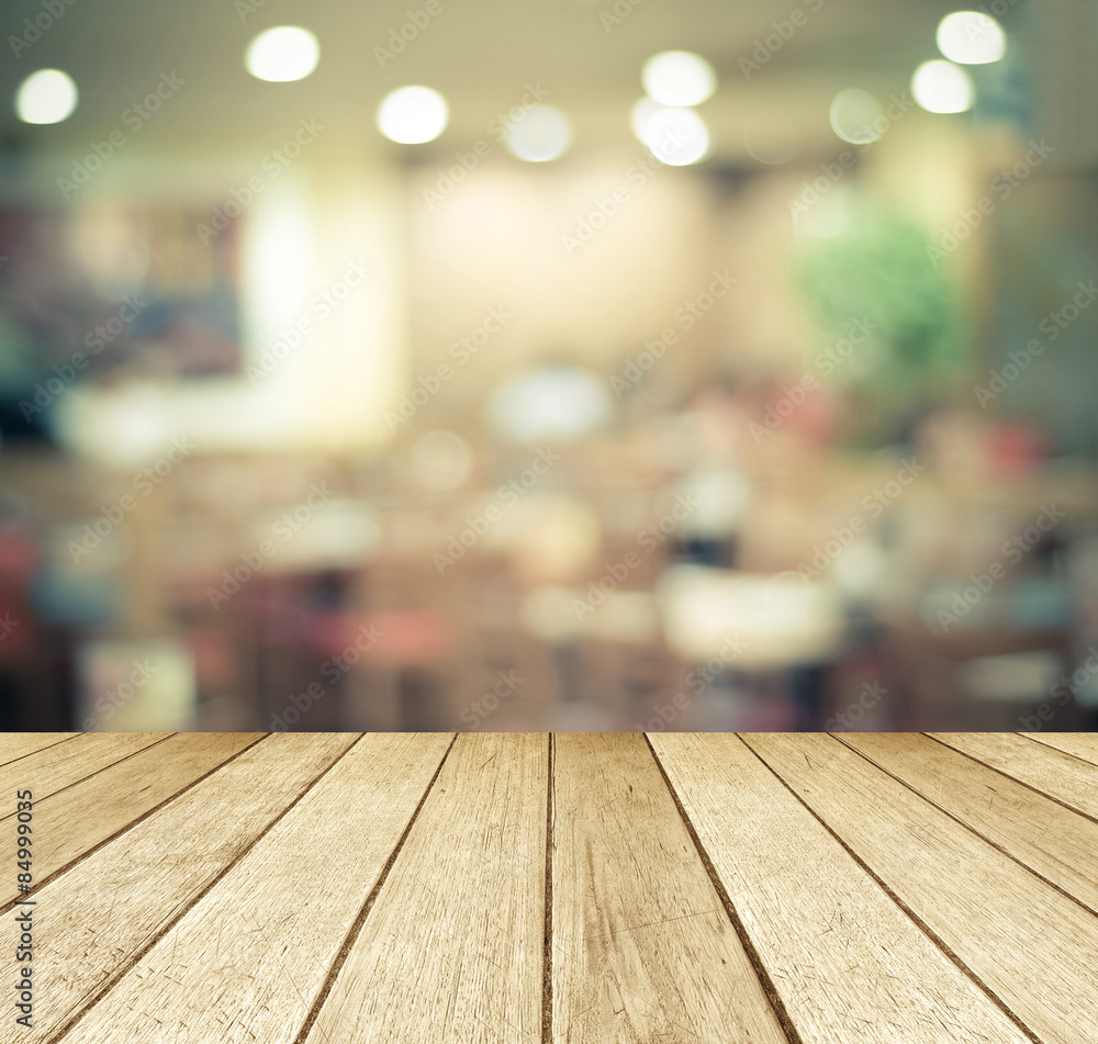 Perspective wood over blurred restaurant with bokeh background Perspective wood over blurred restaurant with bokeh background