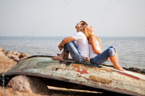 couple sitting on old boat © Petr Malyshev