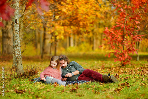 Father and daughter on autumn day