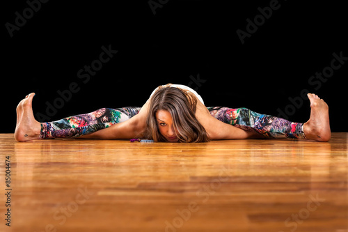 Female Yoga Model Kurmasana Tortoise Pose photo