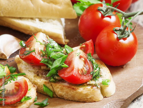 Traditional Italian bruschetta with tomatoes, selective focus