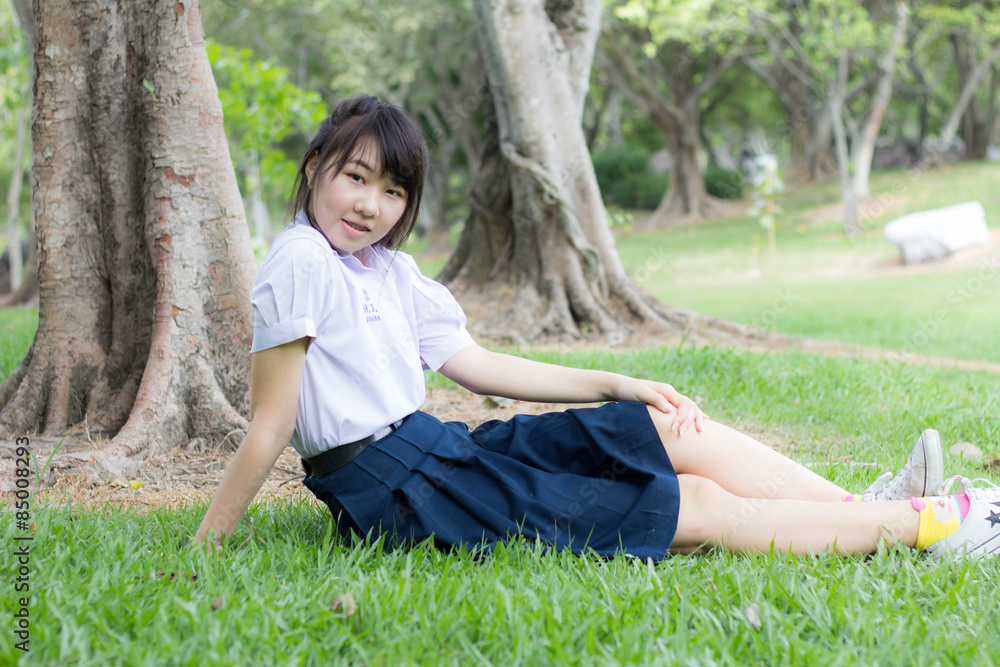 thai student teen relax Sitting On Park thai student teen relax Sitting On Park