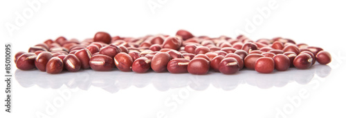Red adzuki beans over white background photo
