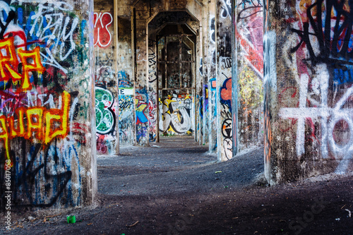 Graffiti under an abandoned pier in Philadelphia, Pennsylvania. © jonbilous
