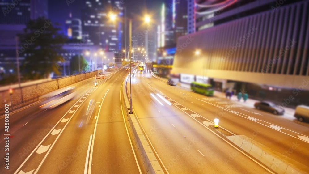Glowing lights from moving cars at night in modern city. Overhead view Glowing lights from moving cars at night in modern city. Overhead view