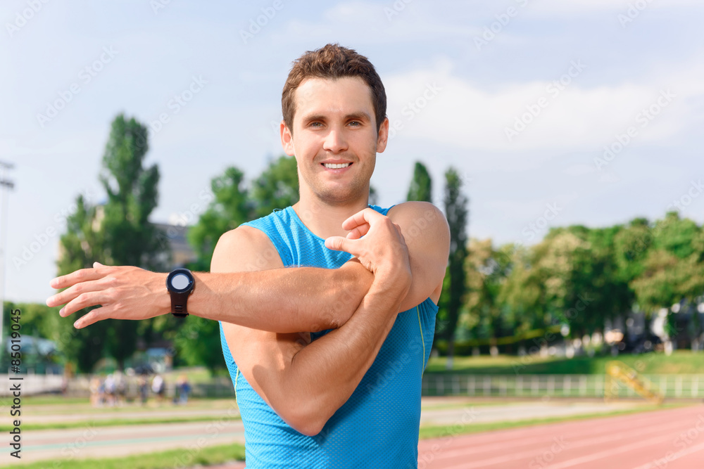 Handsome young man doing stretching Handsome young man doing stretching