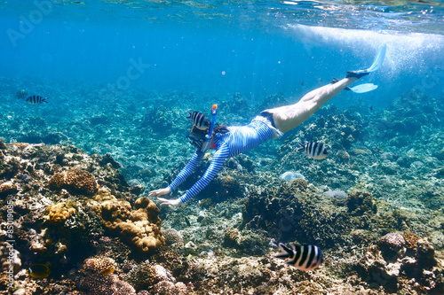 Woman with mask snorkeling