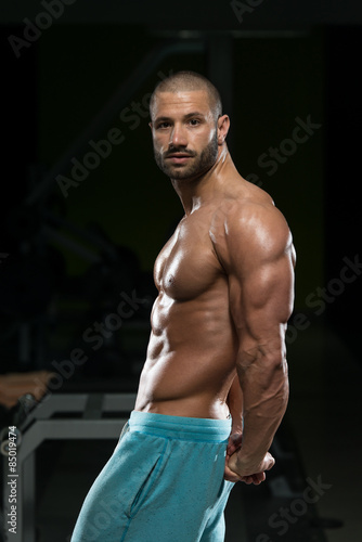 Man In Gym Showing His Well Trained Body © Jale Ibrak