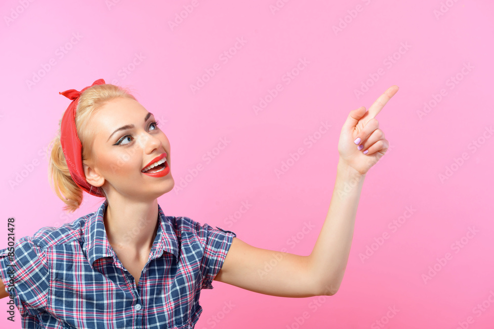 Beautiful pin up girl isolated on pink Beautiful pin up girl isolated on pink