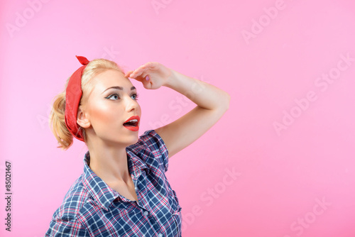 Beautiful pin up girl isolated on pink
