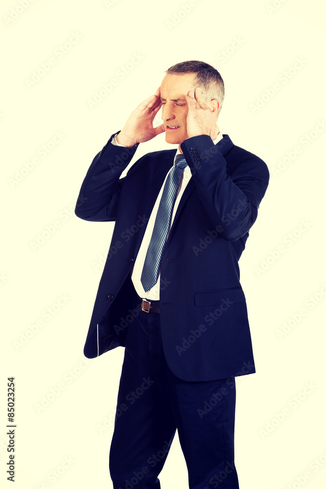 Businessman suffering from headache Businessman suffering from headache