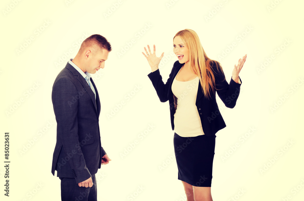 Pregnant businesswoman arguing with her partner Pregnant businesswoman arguing with her partner