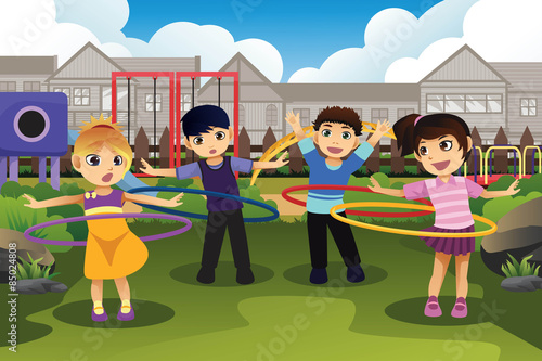 Children playing hula hoop in the park