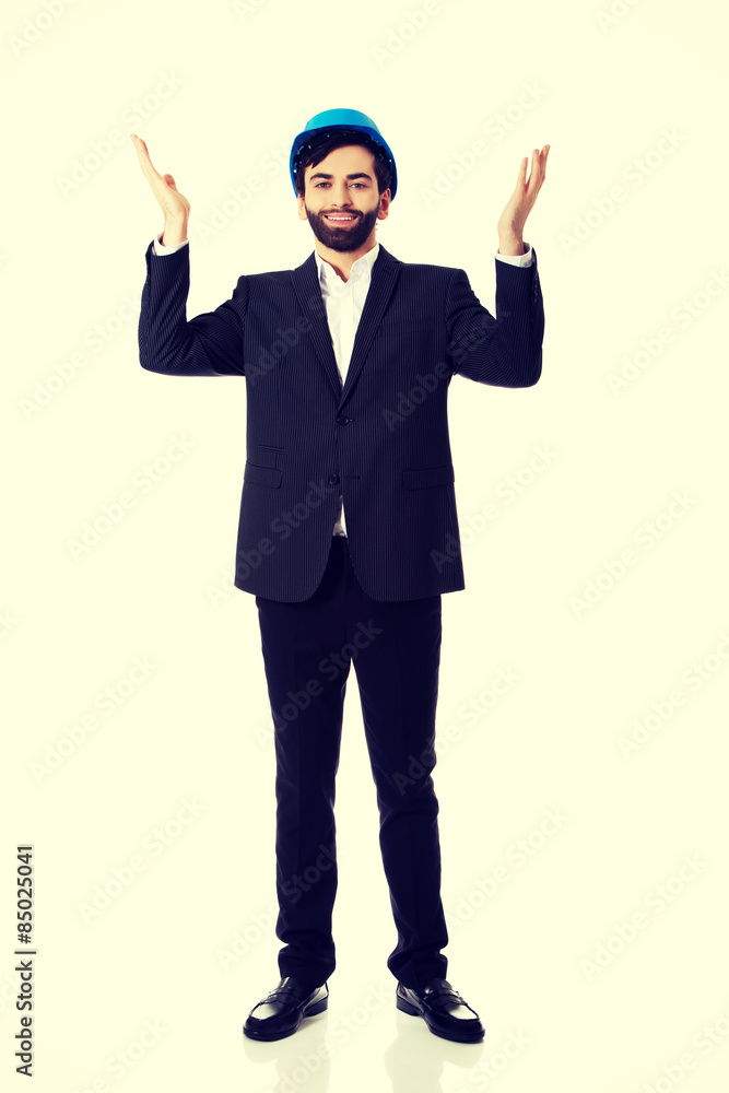 Businessman showing empty copyspace in hands. Businessman showing empty copyspace in hands.