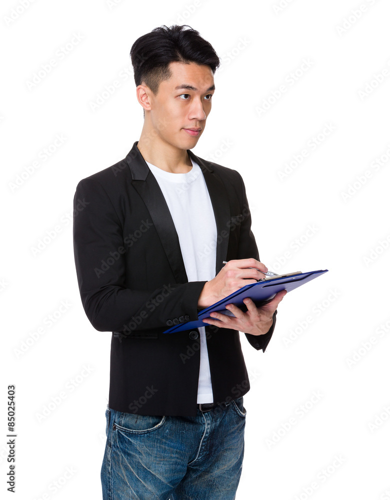 Businessman write on clipboard Businessman write on clipboard
