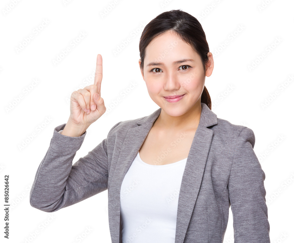 Young businesswoman with finger point up Young businesswoman with finger point up