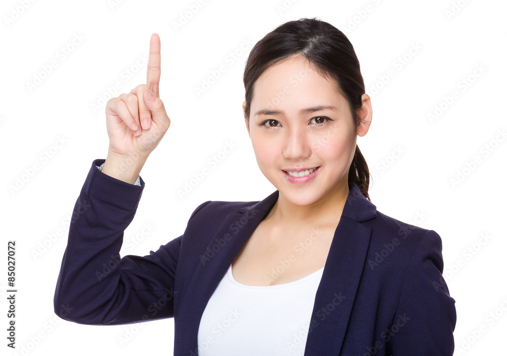 Young businesswoman with finger point up Young businesswoman with finger point up