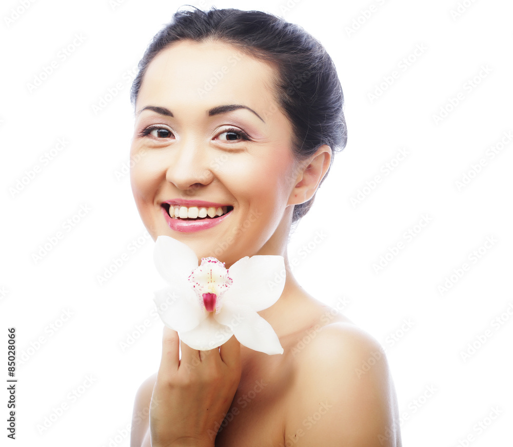 Beautiful woman face with orchid flower Beautiful woman face with orchid flower