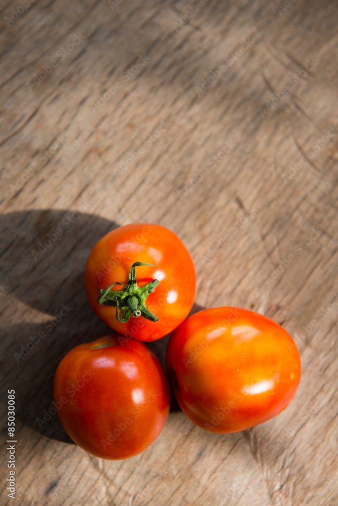 fresh red tomato from garden on plank fresh red tomato from garden on plank
