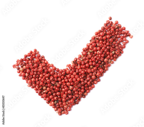 Yes tick mark made of pepper seeds