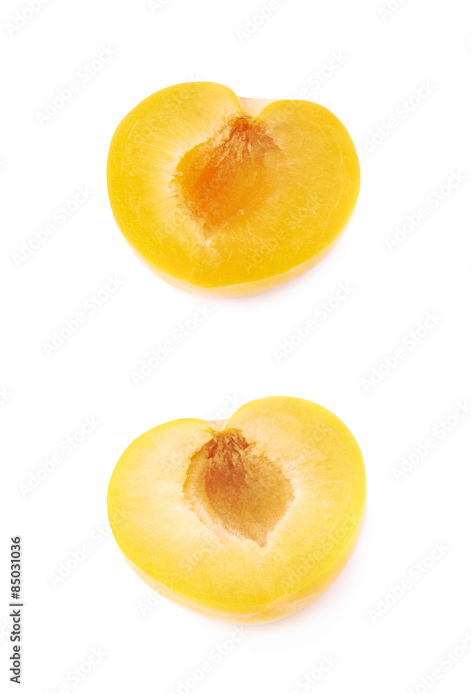 Cut open plum half isolated