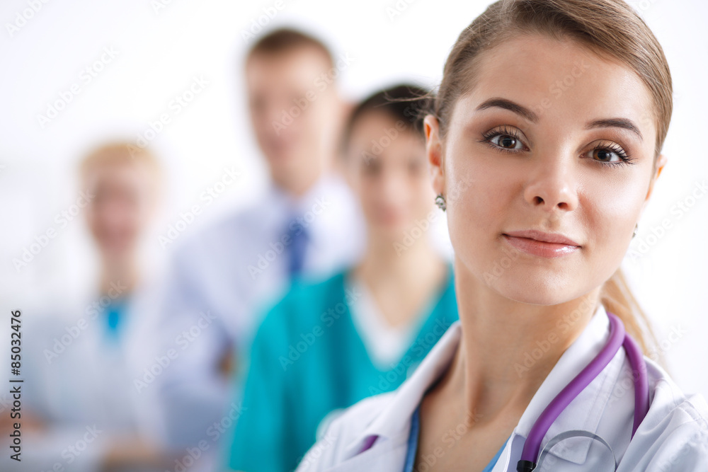 Fototapeta premium Attractive female doctor in front of medical group