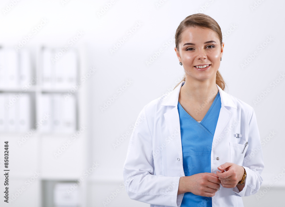 Woman doctor standing with stethoscope at hospital Woman doctor standing with stethoscope at hospital